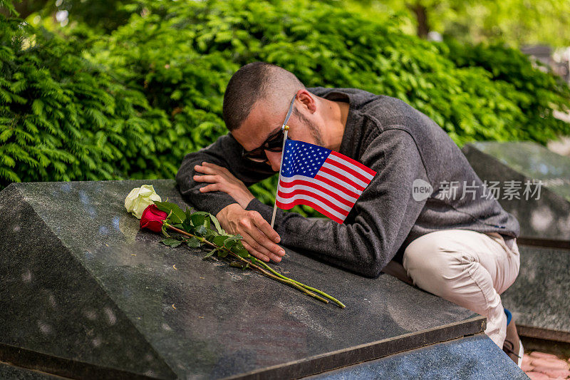 Military veteran visiting his fallen friend on the grave